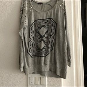 Worn oversized shoulder studded sweater.